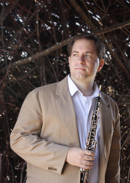 headshot of Brendon with oboe